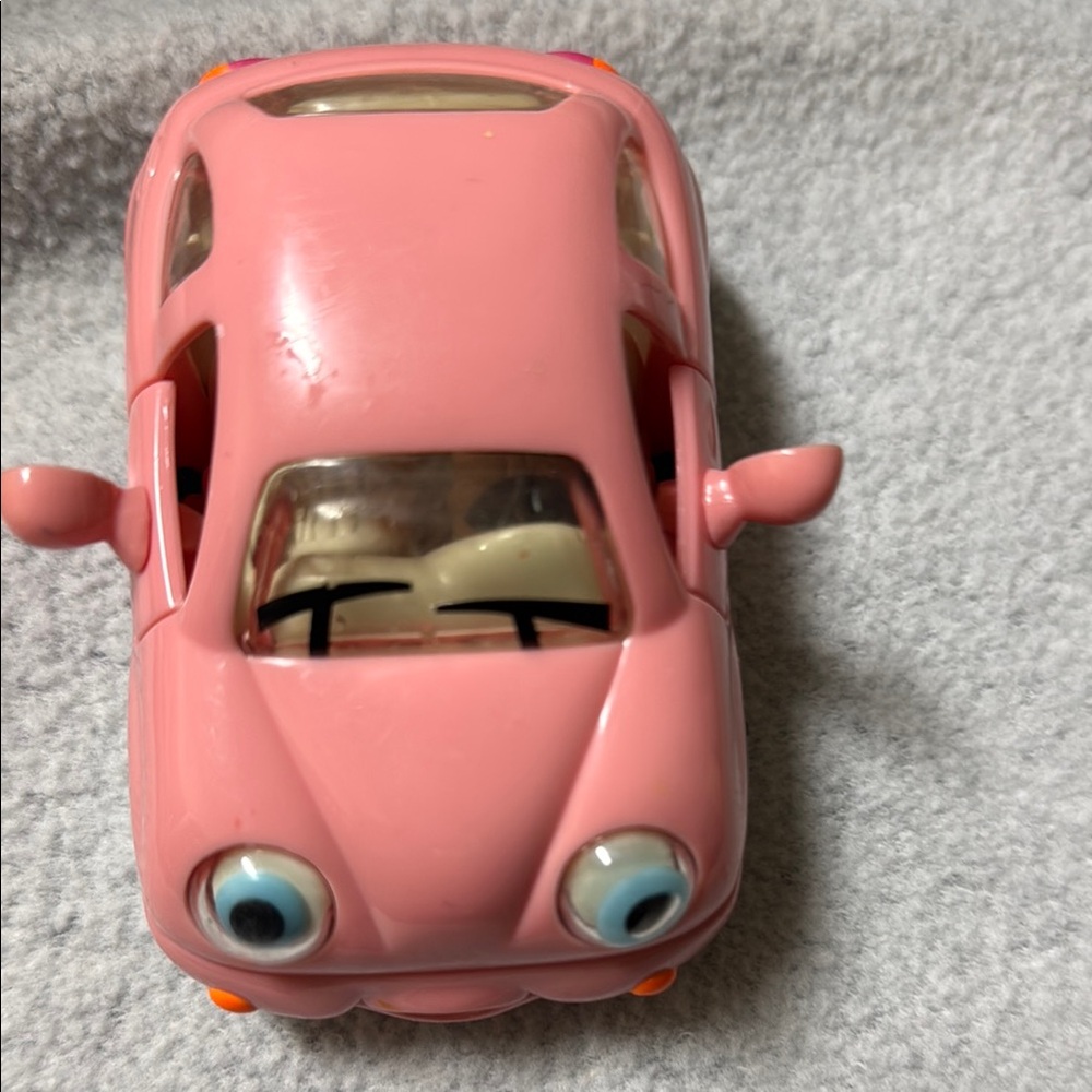Adorable Pink Toy Car with Playful Eyes